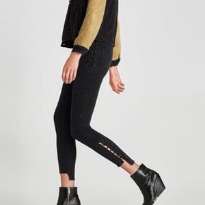 Grey jeans with lace detailing.